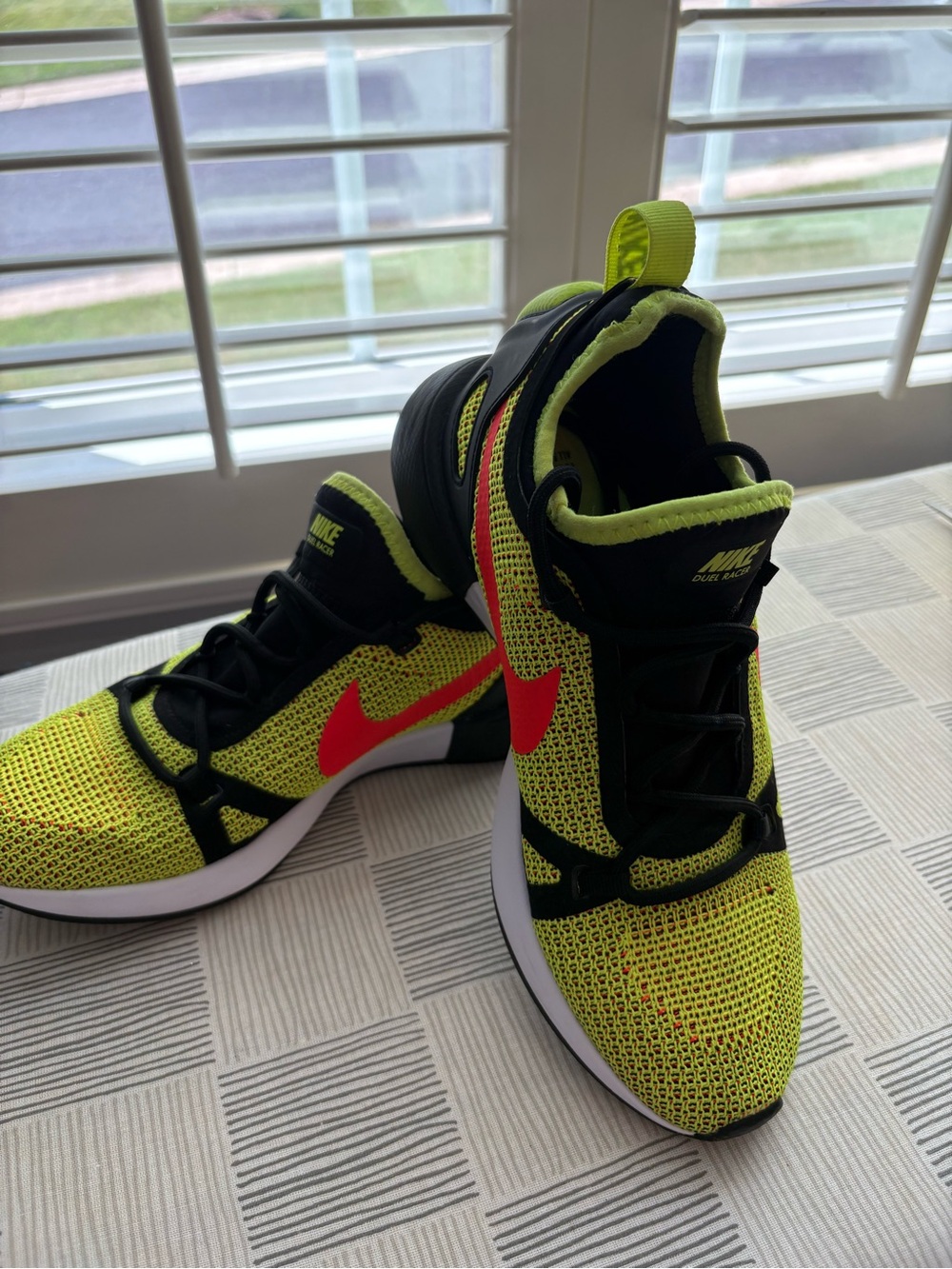 NWOT- Nike women’s Dual Racer- in Neon in bolt/ crimson- black color way.